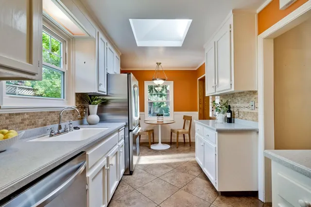 a kitchen with a sink stove and cabinets