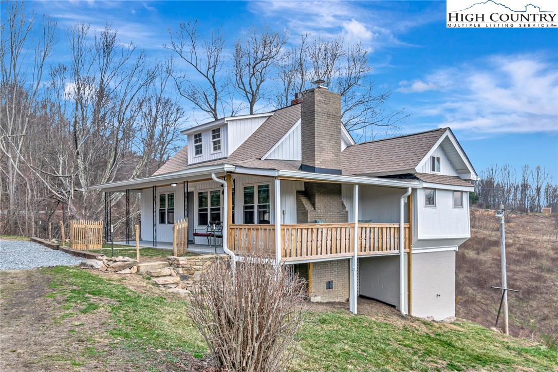 244 Flat Springs Road Elk Park, NC 28622 - Photo 2 of 25 a front view of a house with a yard