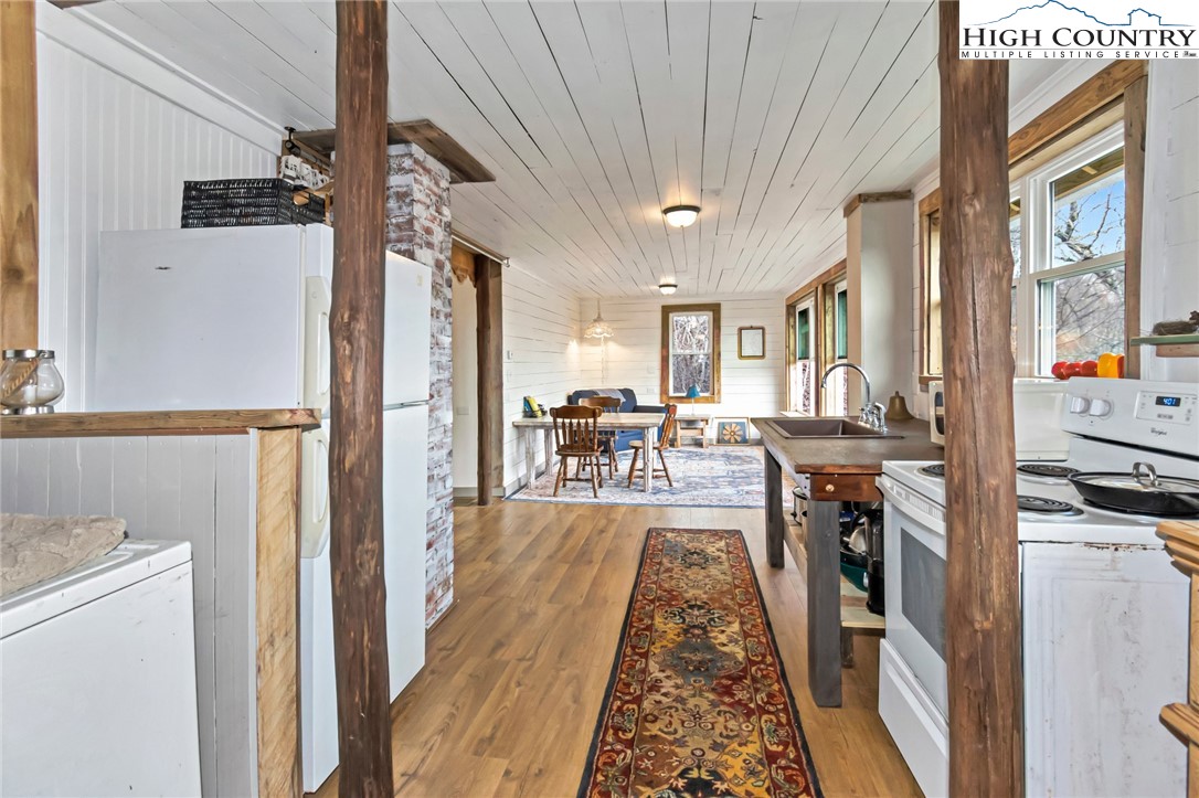 244 Flat Springs Road Elk Park, NC 28622 - Photo 9 of 25 a view of a living room and a livingroom with furniture