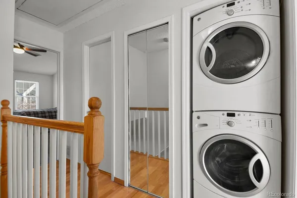 a view of a hallway with washer and dryer