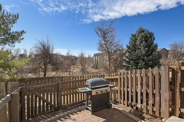 a view of a balcony with wooden fence and floor