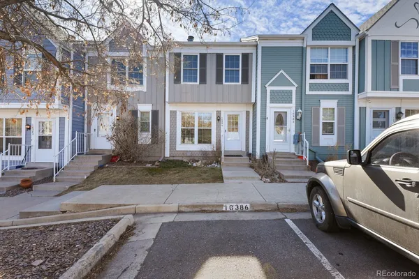 a view of a car parked in front of a house