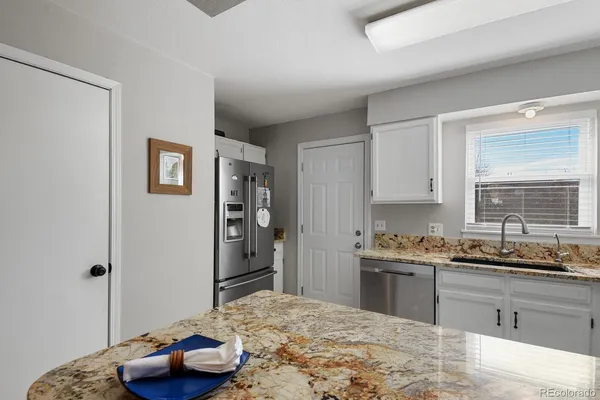 a kitchen with a sink and a stove