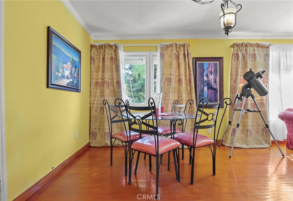 15719 Vose Street Lake Balboa, CA 91406 - Photo 10 of 41 a view of a dining room with furniture and wooden floor