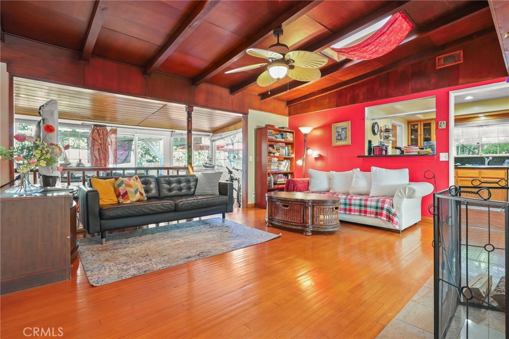 15719 Vose Street Lake Balboa, CA 91406 - Photo 12 of 41 a living room with patio furniture and a floor to ceiling window