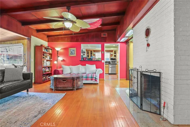 a living room with patio furniture and a floor to ceiling window