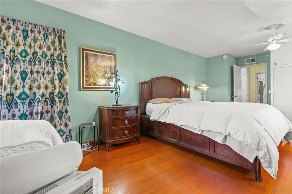 15719 Vose Street Lake Balboa, CA 91406 - Photo 19 of 41 a bedroom with a bed and a couch