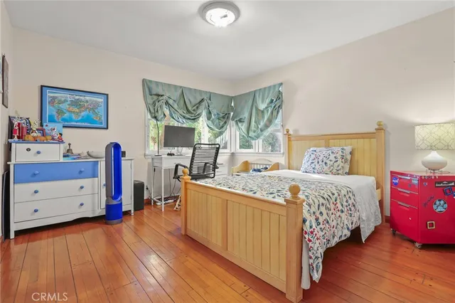a bathroom with a sink toilet vanity and tub