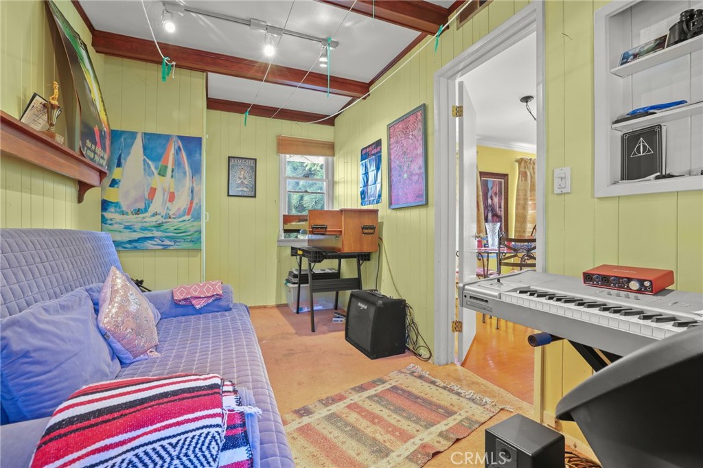 15719 Vose Street Lake Balboa, CA 91406 - Photo 27 of 41 a living room with furniture and a flat screen tv
