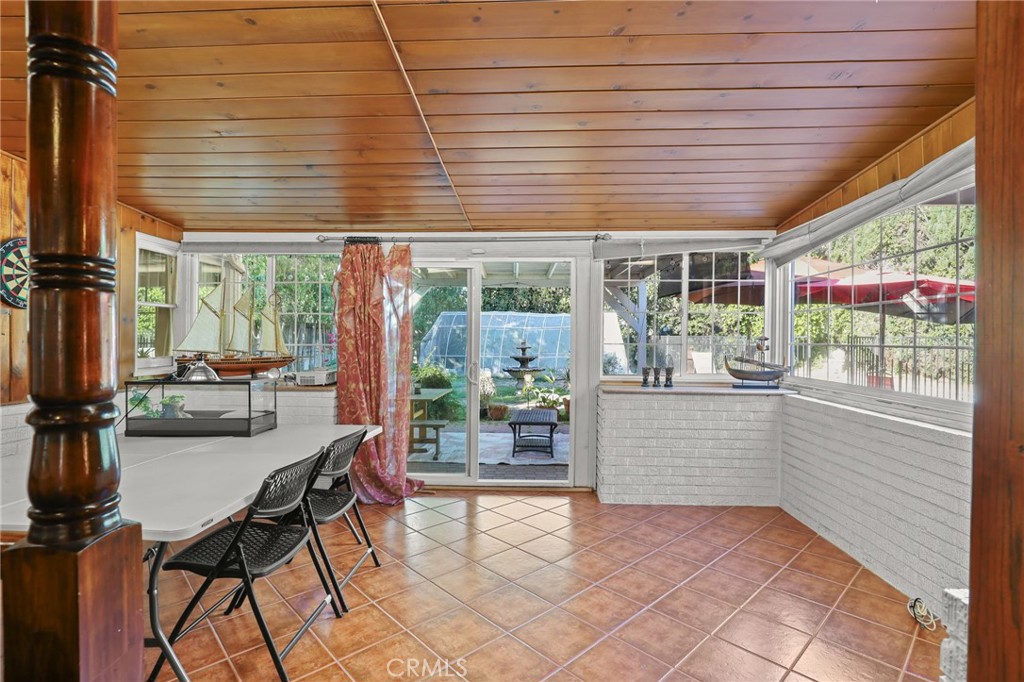 15719 Vose Street Lake Balboa, CA 91406 - Photo 28 of 41 a view of a dining room with furniture and a window