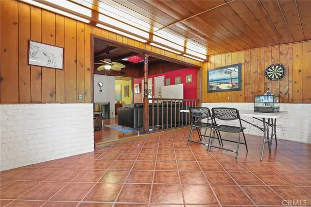 a view of a dining room with furniture and a window