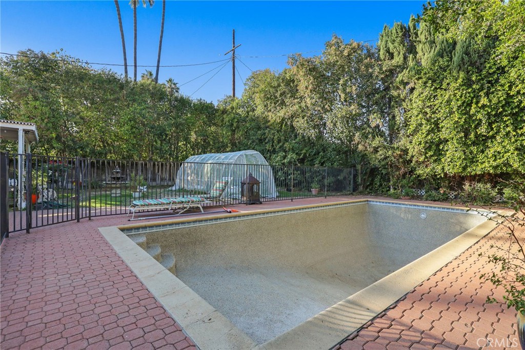 15719 Vose Street Lake Balboa, CA 91406 - Photo 38 of 41 a view of a swimming pool with a chair