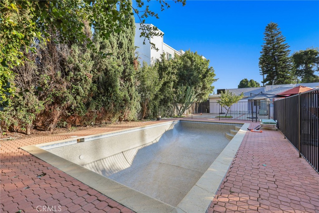 15719 Vose Street Lake Balboa, CA 91406 - Photo 39 of 41 a view of a swimming pool with a patio