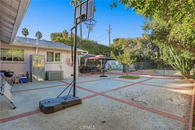 a view of a swimming pool with a patio