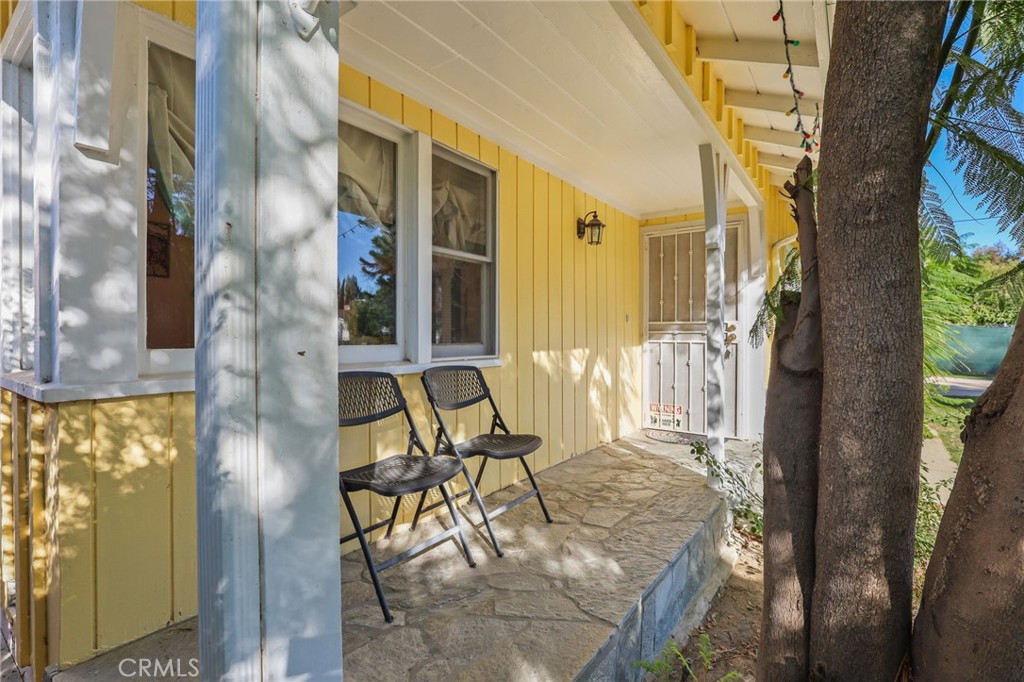 15719 Vose Street Lake Balboa, CA 91406 - Photo 5 of 41 a balcony view with two chairs and a table