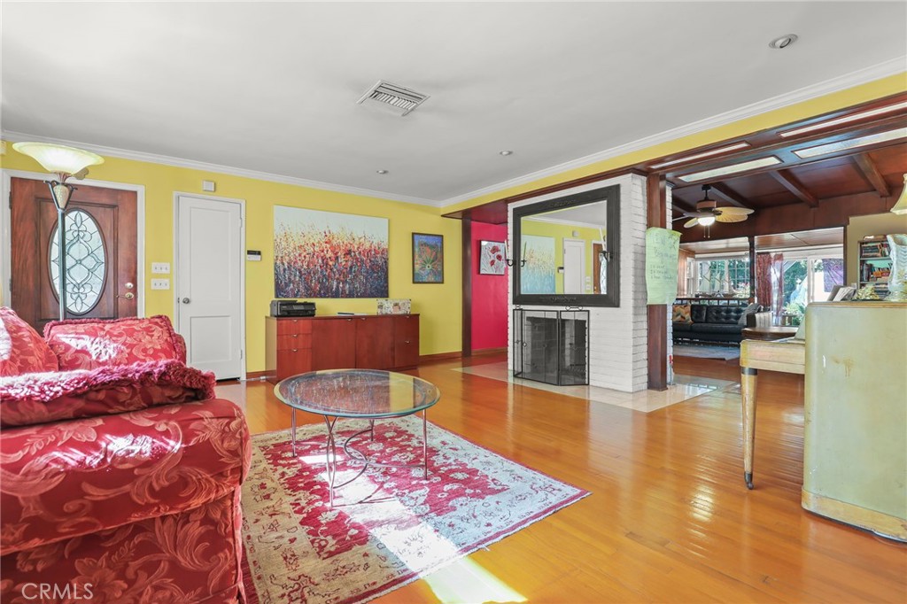 15719 Vose Street Lake Balboa, CA 91406 - Photo 9 of 41 a living room with furniture and a table