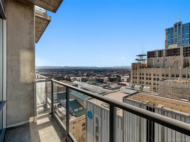 a bathroom with a sink a toilet a mirror a bathtub and shower