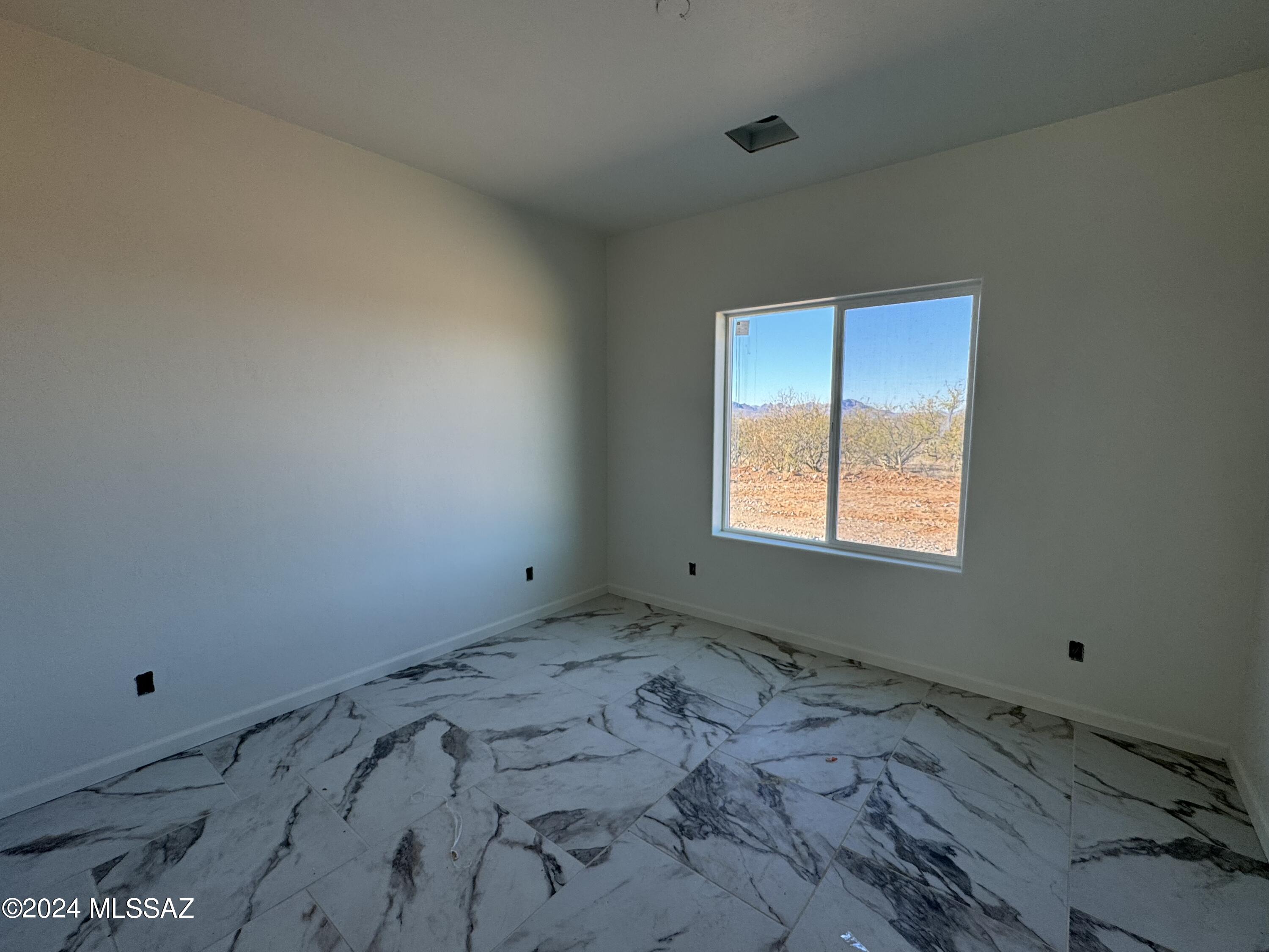1643 Bala Court Rio Rico, AZ 85648 - Photo 9 of 18 a view of empty room with window