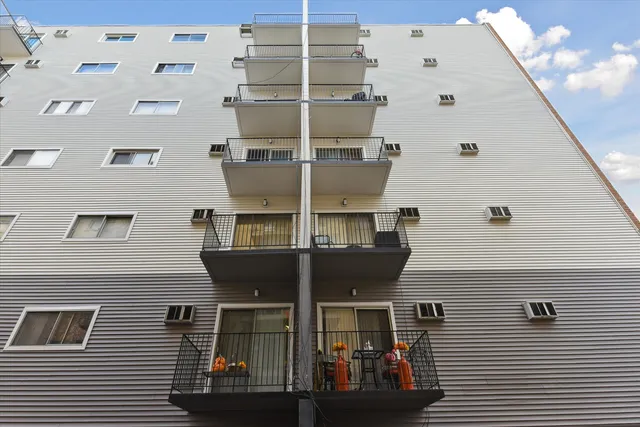 a front view of a building with glass windows