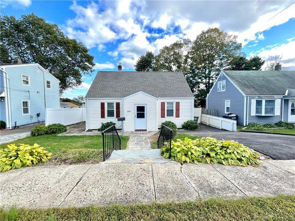 507 Queen Street Bridgeport, CT 06606 - Photo 1 of 1 a view of a house with a yard and a large tree