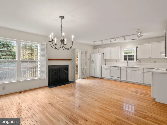 a view of a kitchen with microwave and cabinets