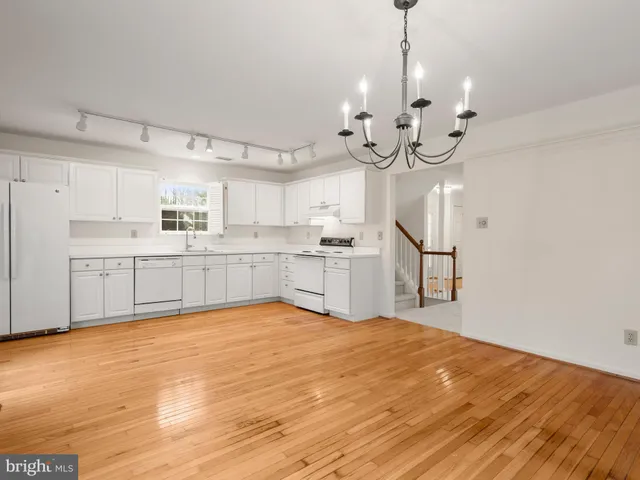 a kitchen with stainless steel appliances granite countertop a sink and cabinets