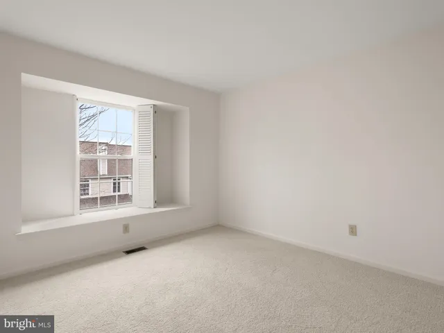 a view of an empty room and entryway