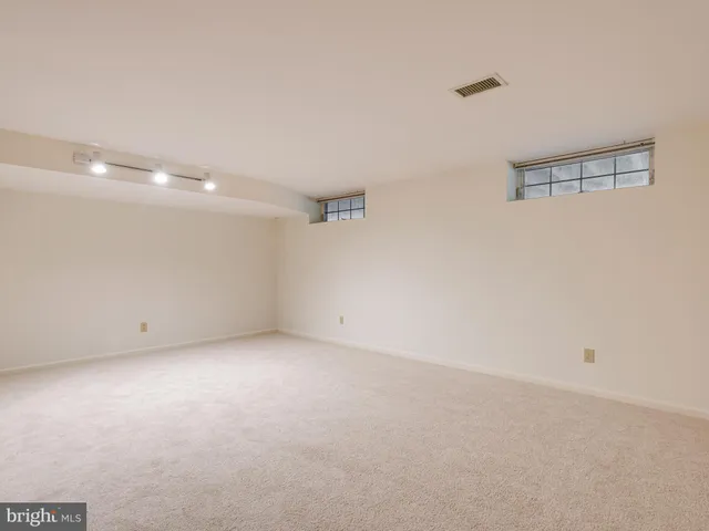 a view of an empty room with stairs