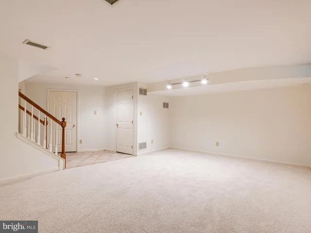 a balcony with wooden floor and fence