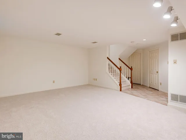 a view of balcony with wooden floor and outdoor seating