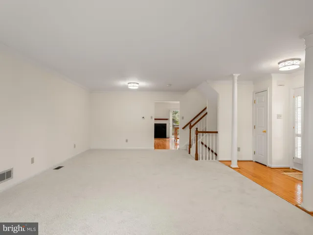 a view of an empty room with stairs