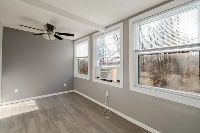 a living room with furniture fireplace and flat screen tv