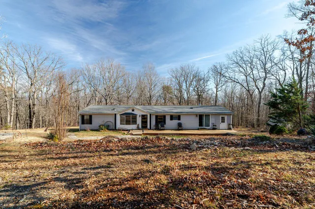 a view of a brick house with potted plants