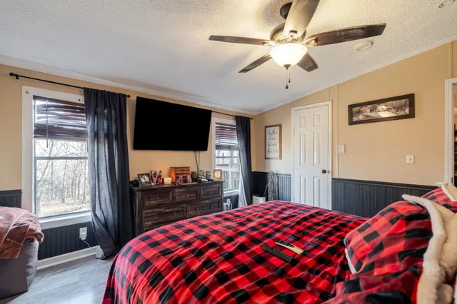 a bathroom with a sink vanity mirror and toilet