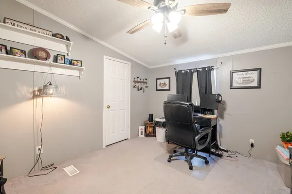 a room with furniture and a flat screen tv