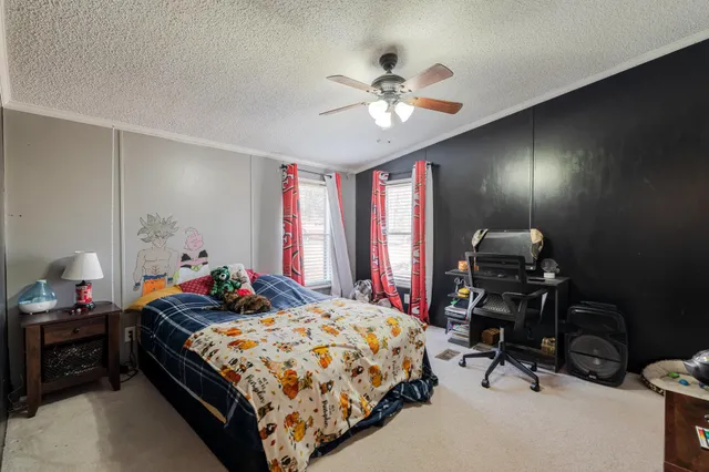 a utility room with dryer washer and a view of living room