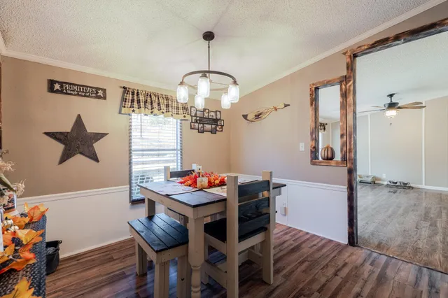 a kitchen with stainless steel appliances granite countertop a stove and cabinets