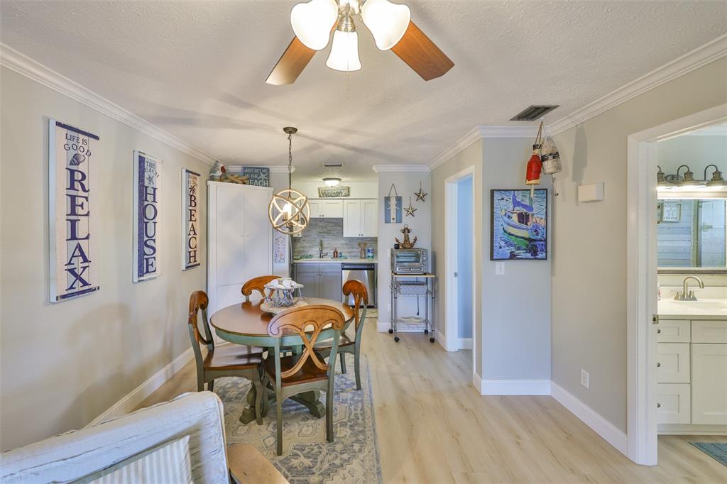 1041 Apollo Beach Boulevard, Unit F Apollo Beach, FL 33572 - Photo 13 of 35 a dining room with furniture and window