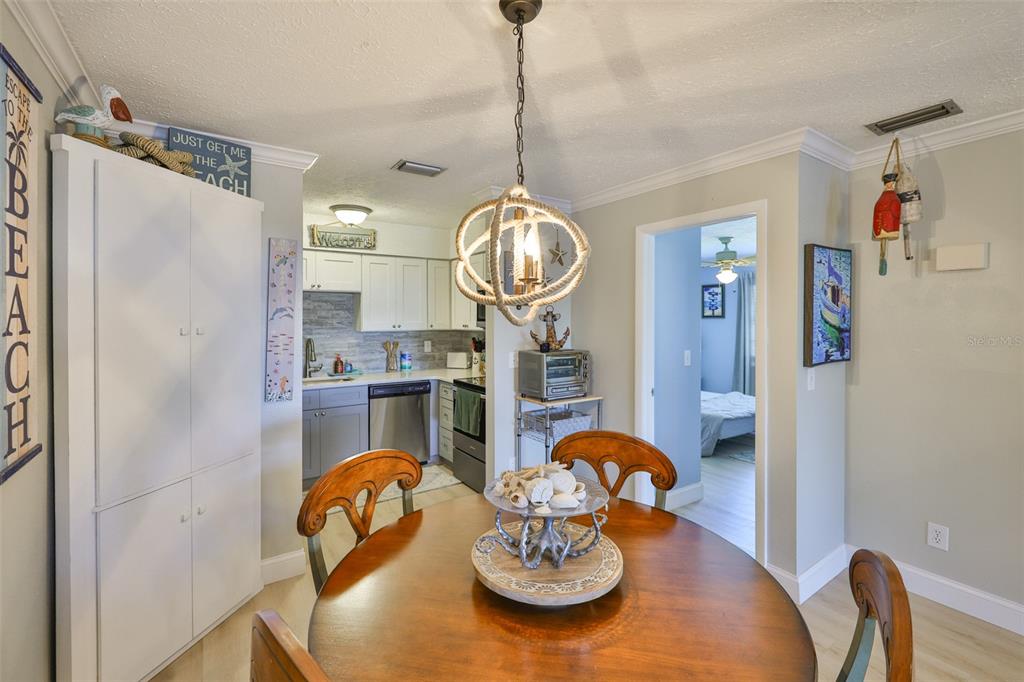 1041 Apollo Beach Boulevard, Unit F Apollo Beach, FL 33572 - Photo 16 of 35 a dining room with furniture and window