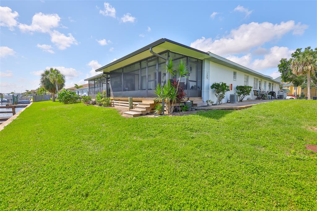 1041 Apollo Beach Boulevard, Unit F Apollo Beach, FL 33572 - Photo 4 of 35 a view of a house with a yard and sitting area