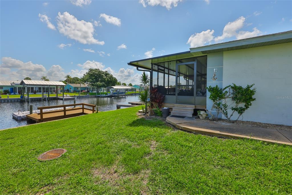 1041 Apollo Beach Boulevard, Unit F Apollo Beach, FL 33572 - Photo 7 of 35 a view of a house with backyard and sitting area