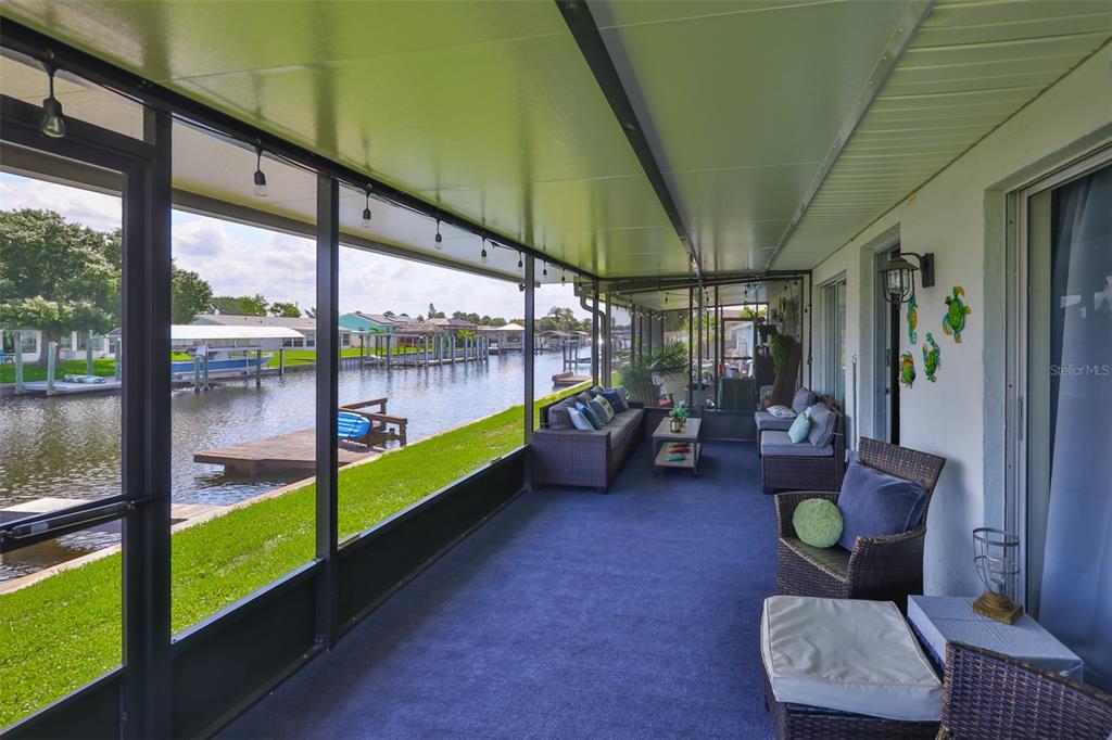 1041 Apollo Beach Boulevard, Unit F Apollo Beach, FL 33572 - Photo 8 of 35 a living room with patio and furniture