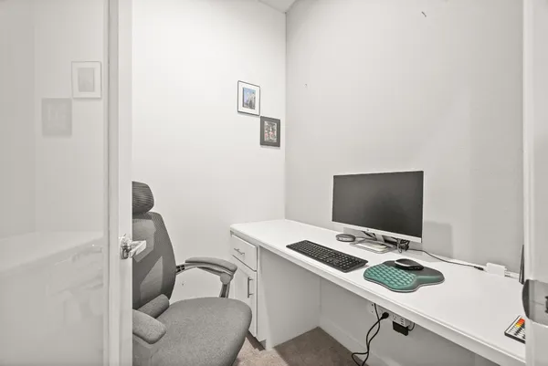 a view of a workspace with furniture