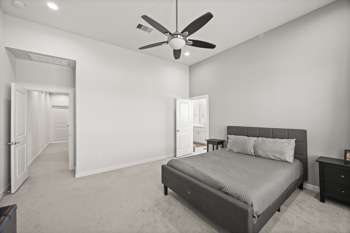 4002 Elser Street Houston, TX 77009 - Photo 14 of 36 a bedroom with a bed and window