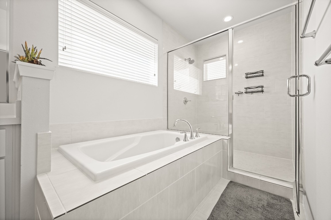 4002 Elser Street Houston, TX 77009 - Photo 20 of 36 a bathroom with a tub a sink and a shower