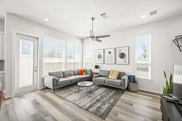 a living room with furniture and a large window
