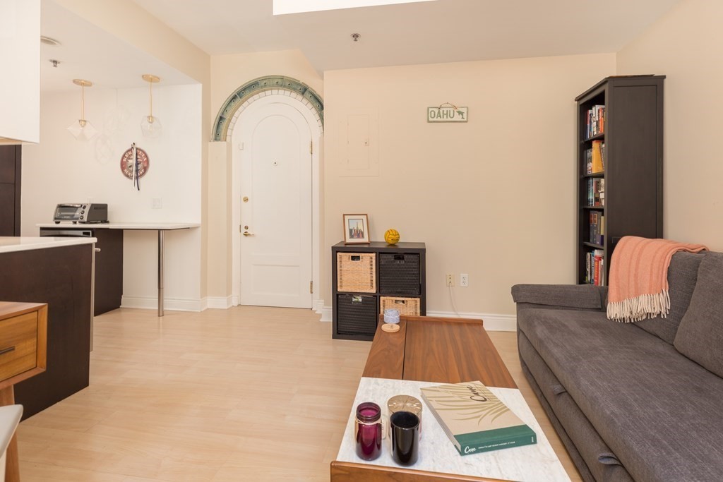 4 Charlesgate East, Unit 107 Boston, MA 02215 - Photo 4 of 12 a living room with furniture and a rug