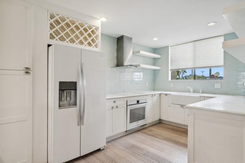 4068 Tivoli Court Lake Worth, FL 33467 - Photo 1 of 20 a kitchen with cabinets and wooden floor