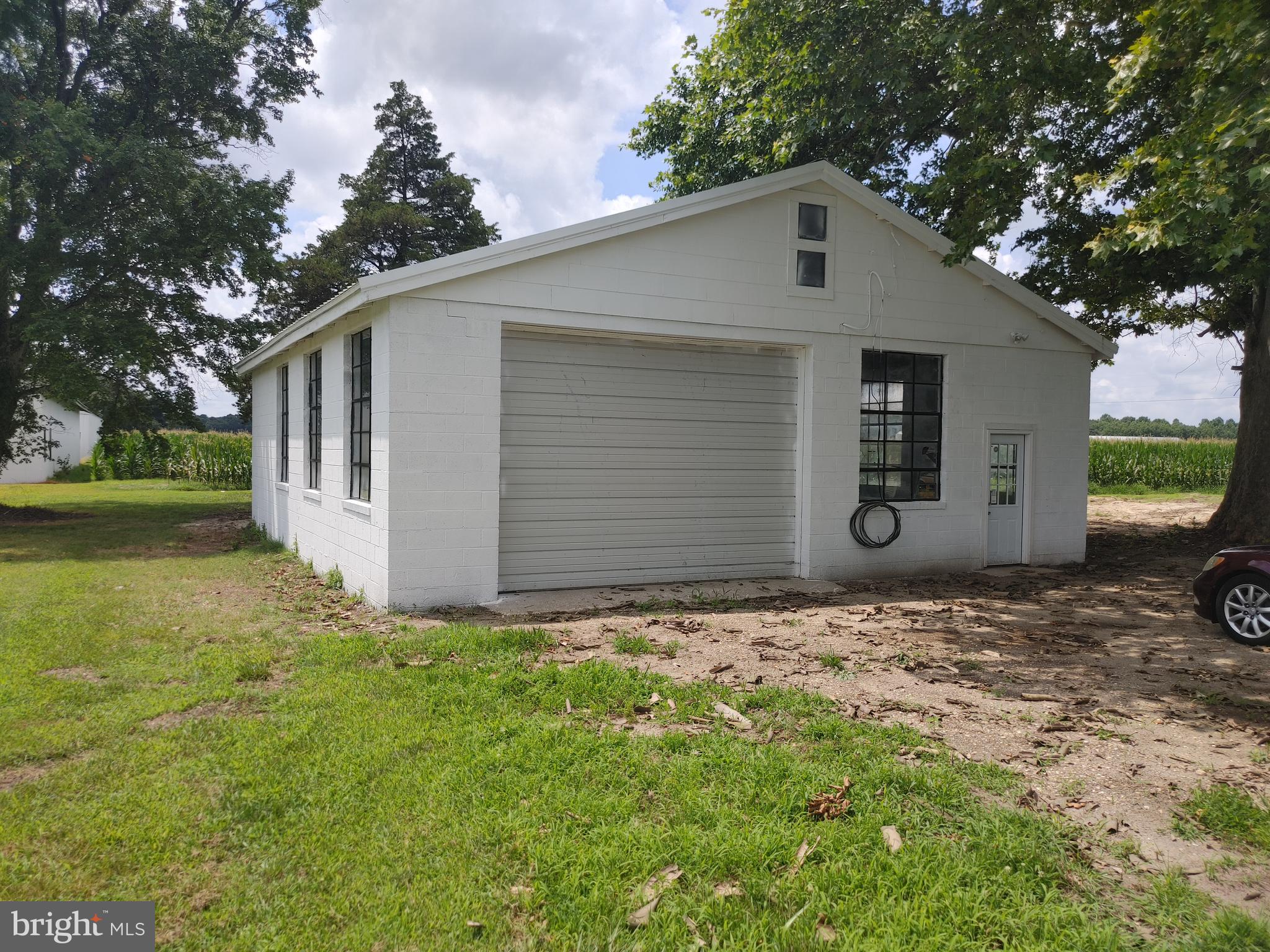 28035 Possum Hill Road Federalsburg, MD 21632 - Photo 4 of 23 a front view of a house with a yard