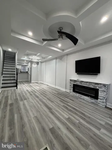 a view of a livingroom with furniture and an empty room